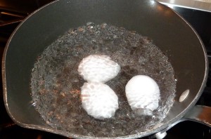 boiling eggs which have been swirled in the water