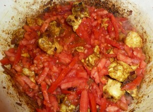 Chicken Curry - add the chicken and tomatoes