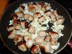 Tortellini with Sausage and Mushrooms - stir fry sausage, onion and garlic